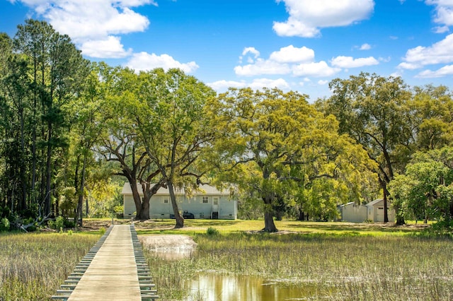 surrounding community featuring a water view