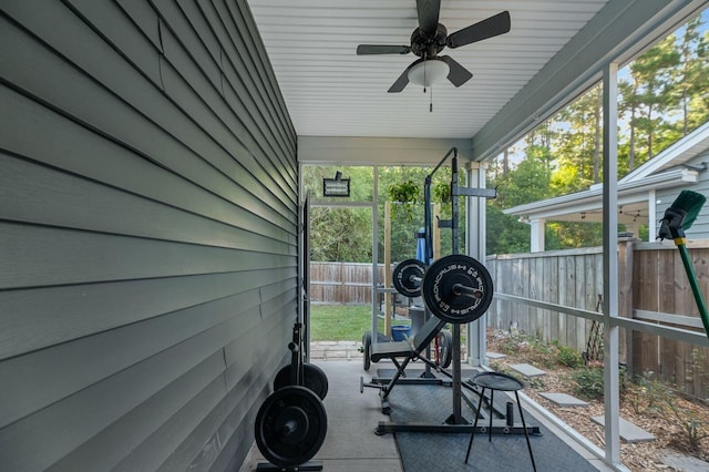 exercise area featuring a wealth of natural light and ceiling fan