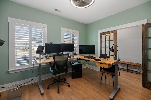 office area with light hardwood / wood-style flooring