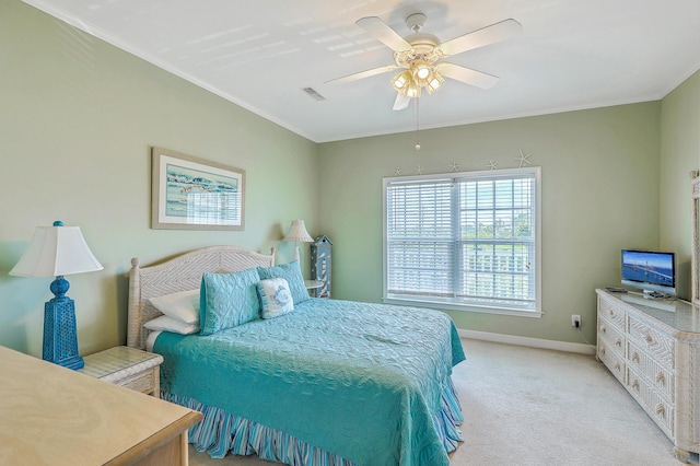 2393 Folly Rd Unit 1G, Folly Beach, SC 29439 - bedroom featuring light carpet, baseboards, crown molding, and a ceiling fan