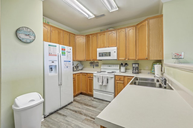 2393 Folly Rd Unit 1G, Folly Beach, SC 29439 - kitchen with white appliances, a sink, light countertops, light wood-type flooring, and ornamental molding
