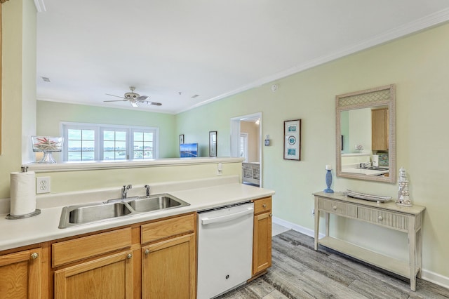 2393 Folly Rd Unit 1G, Folly Beach, SC 29439 - kitchen with dishwasher, a sink, light wood finished floors, crown molding, and light countertops