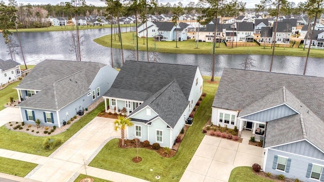 aerial view featuring a residential view and a water view