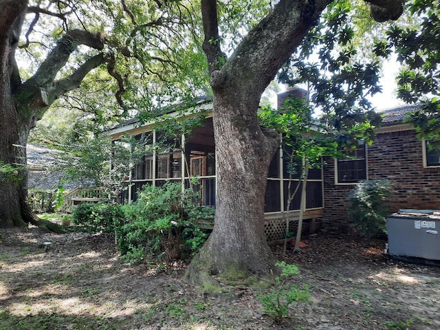 exterior space featuring a sunroom