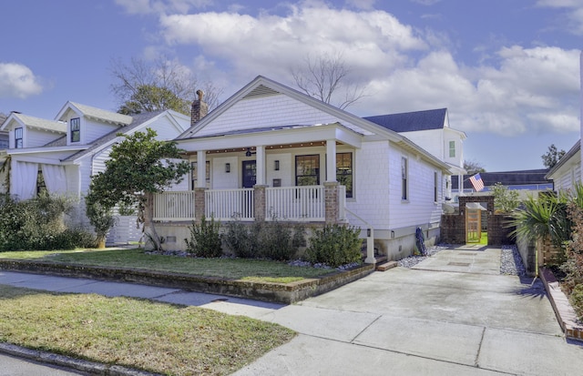 view of front of house with a front lawn and a porch