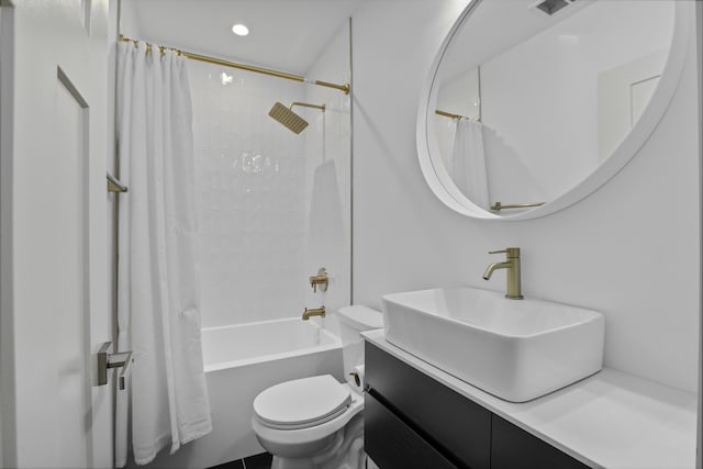 full bathroom featuring vanity, shower / bath combo, and toilet