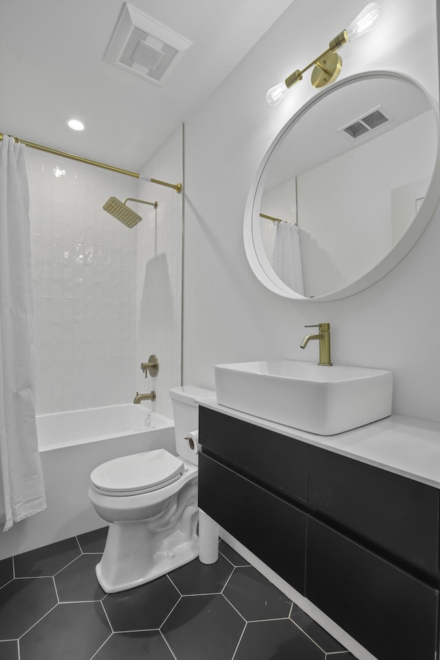 full bathroom with tile patterned flooring, vanity, toilet, and shower / tub combo