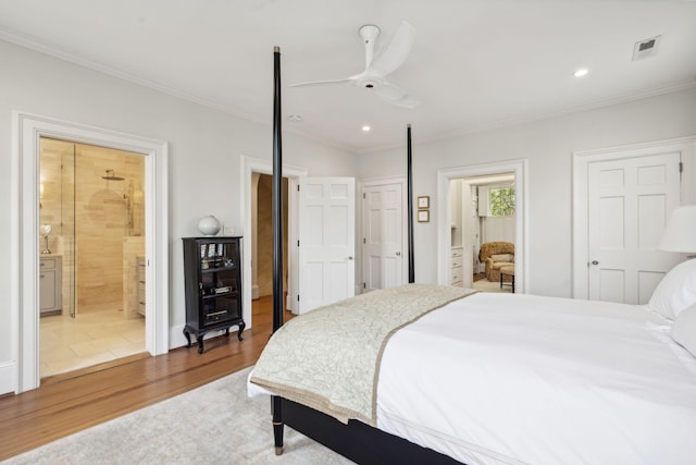 bedroom featuring ceiling fan, ensuite bathroom, crown molding, and wood-type flooring