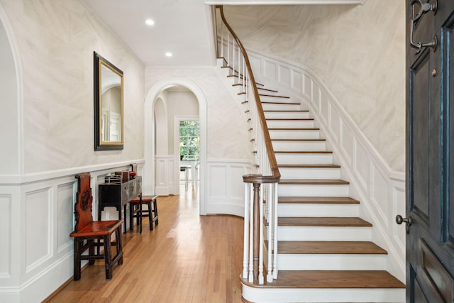 staircase with wood-type flooring