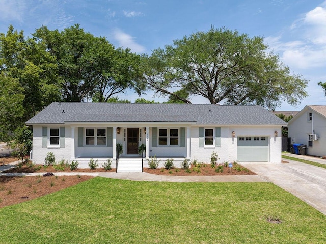 1199 Island View Dr, Mount Pleasant, SC 29464 - ranch-style house featuring brick siding, covered porch, a garage, concrete driveway, and a front yard