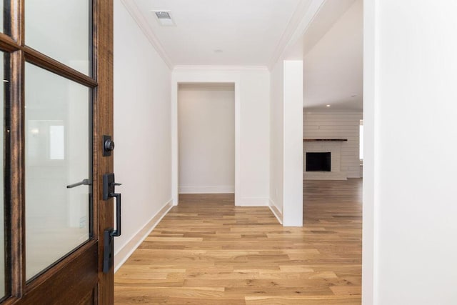 1199 Island View Dr, Mount Pleasant, SC 29464 - hall with light wood-type flooring, crown molding, visible vents, and baseboards