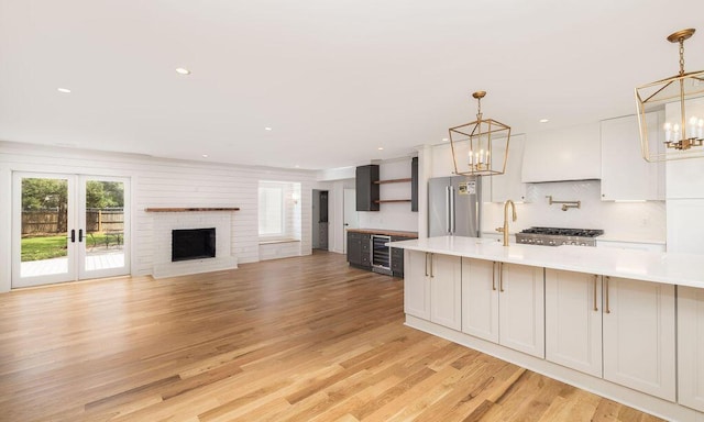 1199 Island View Dr, Mount Pleasant, SC 29464 - kitchen featuring a chandelier, beverage cooler, stainless steel appliances, and open shelves