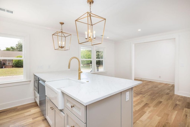 1199 Island View Dr, Mount Pleasant, SC 29464 - kitchen with a sink, a peninsula, crown molding, a chandelier, and stainless steel dishwasher