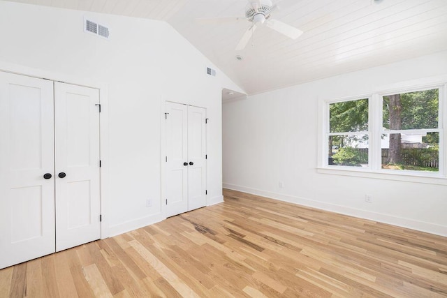 1199 Island View Dr, Mount Pleasant, SC 29464 - unfurnished bedroom featuring high vaulted ceiling, visible vents, two closets, baseboards, and light wood-style floors