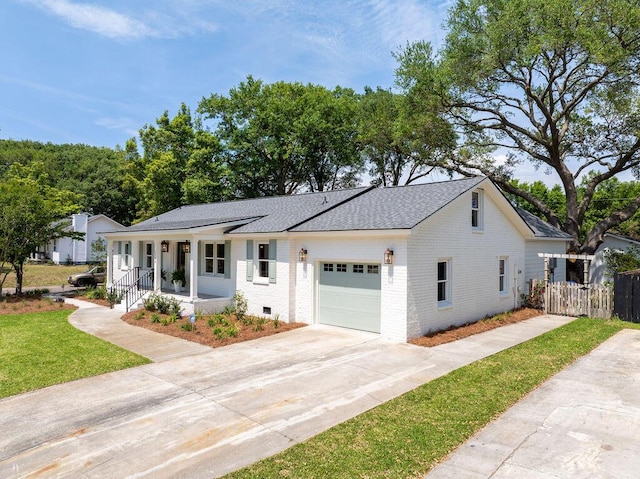 1199 Island View Dr, Mount Pleasant, SC 29464 - view of front facade with covered porch, roof with shingles, brick siding, driveway, and a garage