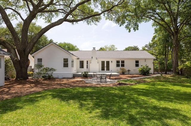 1199 Island View Dr, Mount Pleasant, SC 29464 - rear view of property with a patio, french doors, a chimney, and a lawn