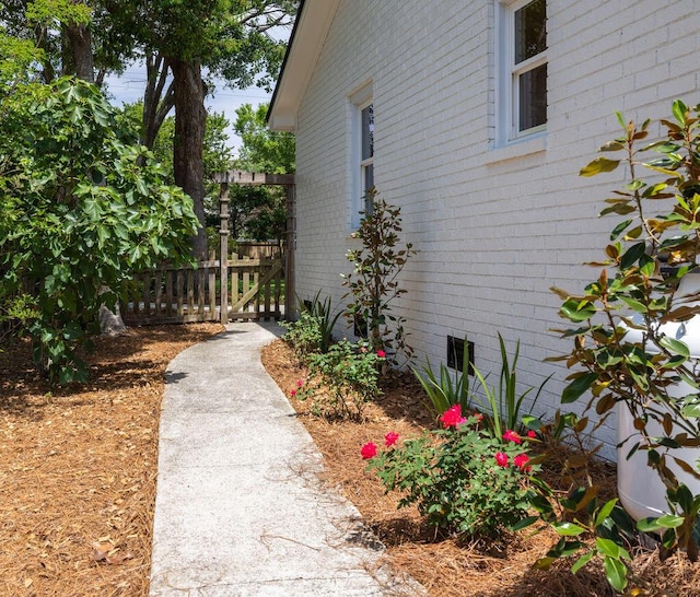 1199 Island View Dr, Mount Pleasant, SC 29464 - view of home's exterior featuring fence and brick siding