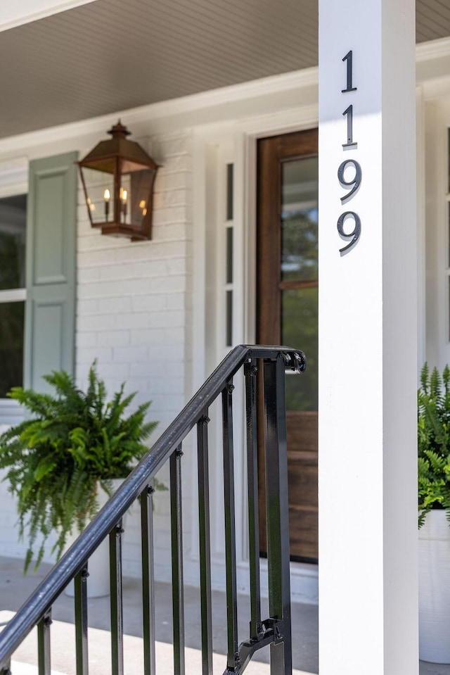 1199 Island View Dr, Mount Pleasant, SC 29464 - view of exterior entry with concrete block siding and a balcony