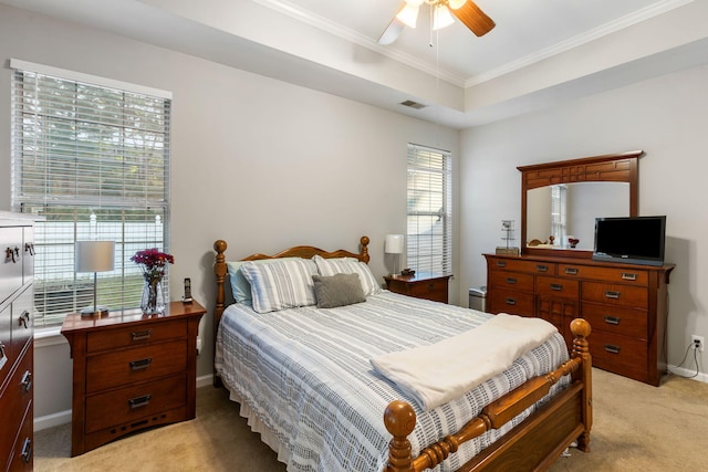 bedroom featuring light colored carpet, multiple windows, crown molding, and ceiling fan