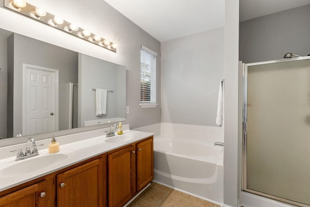 bathroom with shower with separate bathtub, vanity, and tile patterned floors