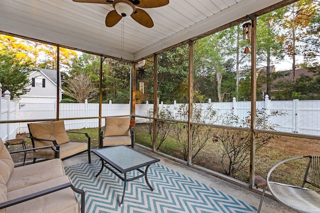 sunroom with ceiling fan and wood ceiling