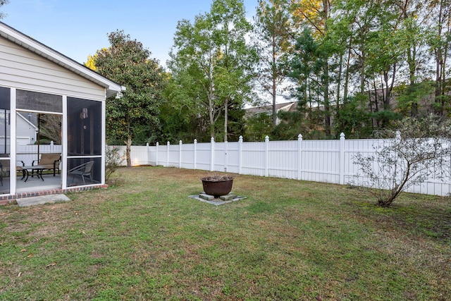 view of yard with a sunroom