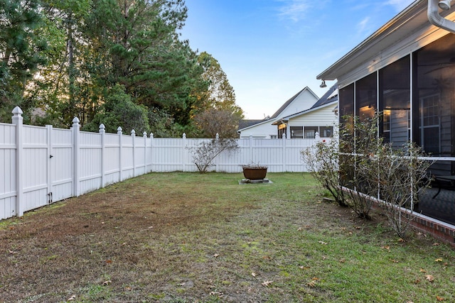 view of yard with a sunroom