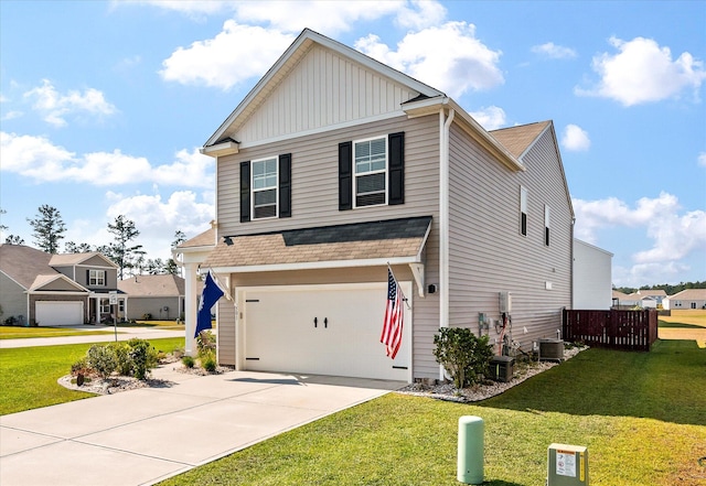 view of front facade featuring central AC, a front lawn, and a garage