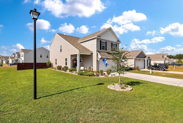 view of property featuring a front lawn and a garage