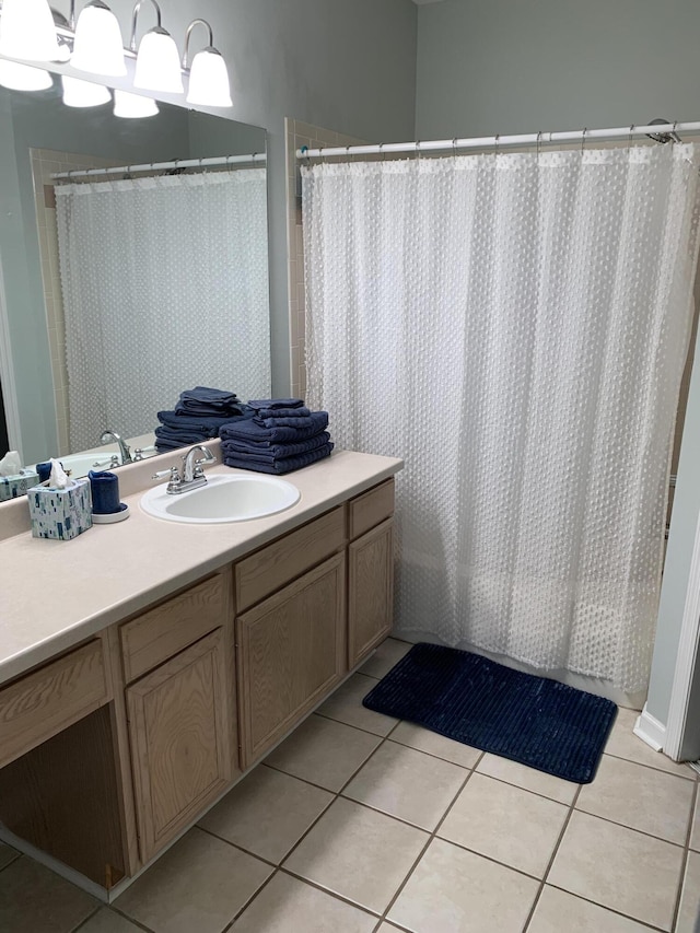full bathroom featuring tile patterned flooring, a shower with curtain, and vanity