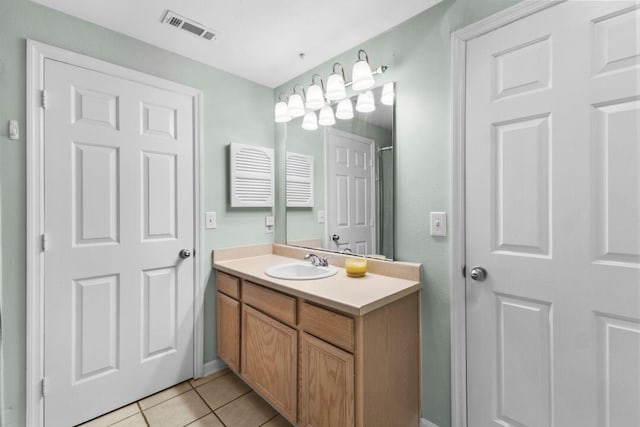 bathroom with vanity, tile patterned floors, and visible vents