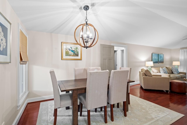 dining room with an inviting chandelier and dark hardwood / wood-style flooring