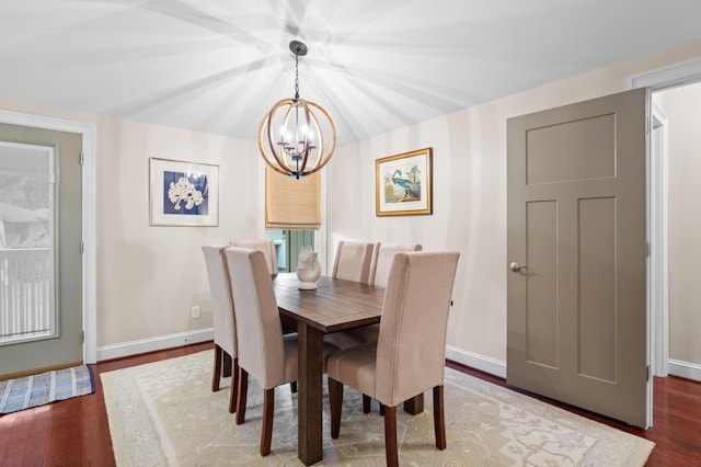 dining room featuring a chandelier and dark hardwood / wood-style flooring