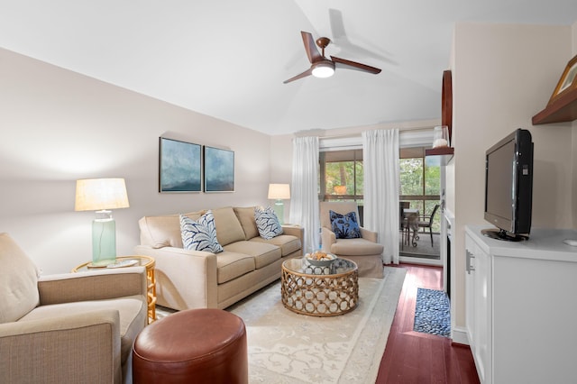 living room with vaulted ceiling, ceiling fan, and wood-type flooring