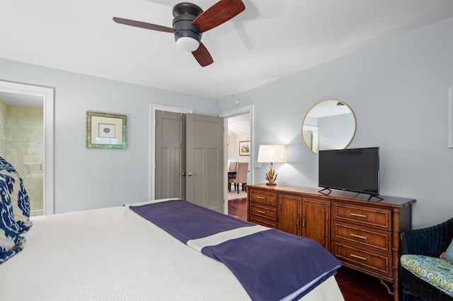 bedroom featuring dark wood-type flooring, ceiling fan, and ensuite bath