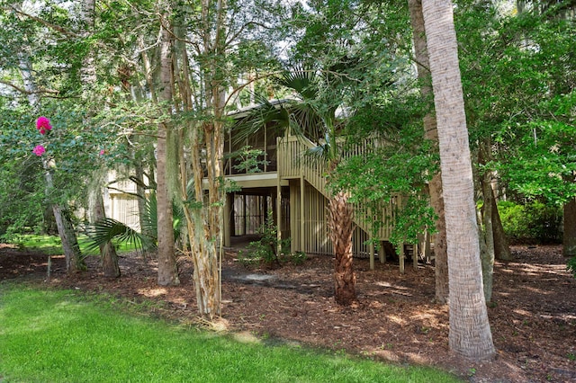 view of front of house with a sunroom