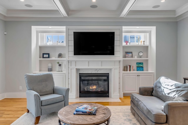 living room featuring recessed lighting, a high end fireplace, baseboards, light wood-type flooring, and beam ceiling