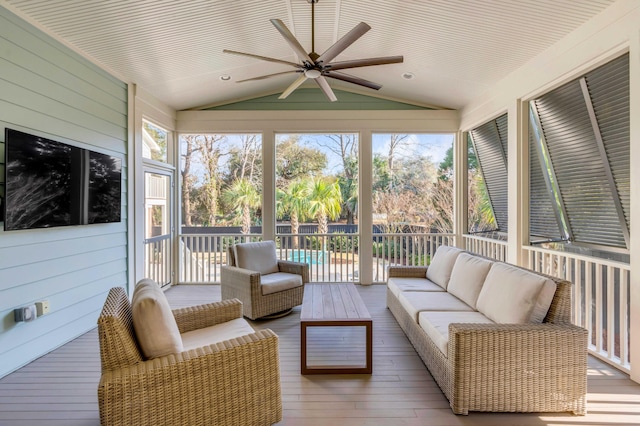 sunroom / solarium with vaulted ceiling and ceiling fan