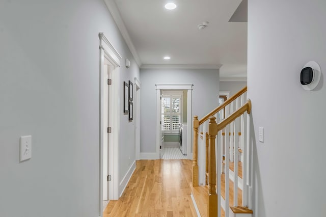 hall with baseboards, stairway, crown molding, light wood-style floors, and recessed lighting