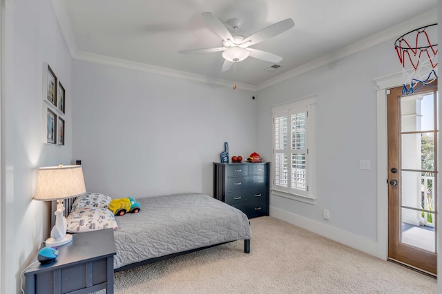 carpeted bedroom featuring a ceiling fan, visible vents, ornamental molding, and baseboards