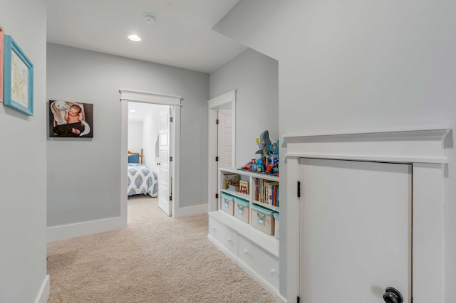 hallway with recessed lighting, carpet flooring, and baseboards