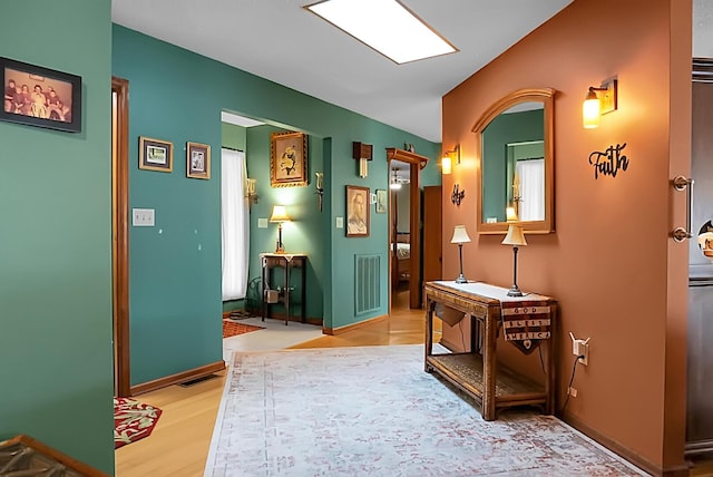 corridor featuring light hardwood / wood-style flooring