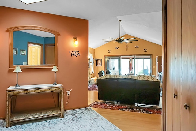 interior space featuring hardwood / wood-style flooring, lofted ceiling, and ceiling fan