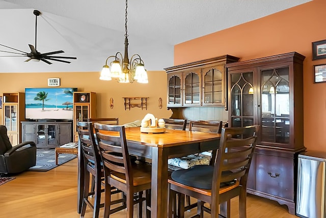 dining room featuring a chandelier and light wood-type flooring