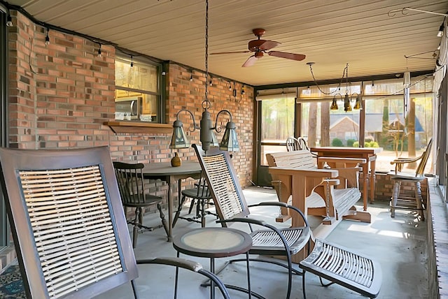 sunroom / solarium featuring ceiling fan