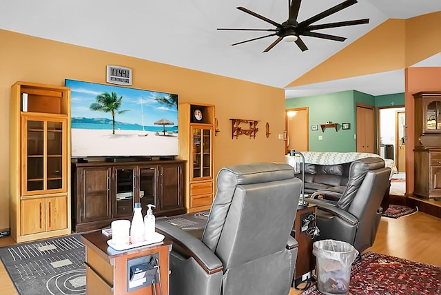 living room with vaulted ceiling, ceiling fan, and hardwood / wood-style floors