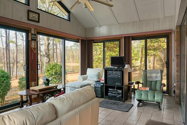 sunroom with lofted ceiling and ceiling fan