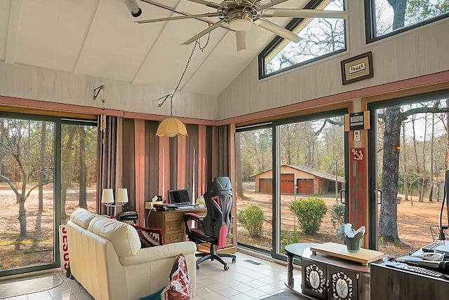 sunroom / solarium featuring lofted ceiling and ceiling fan