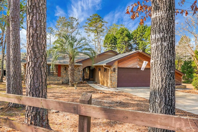 single story home featuring a garage