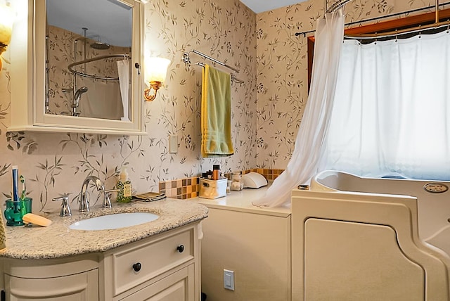 bathroom with vanity and walk in shower